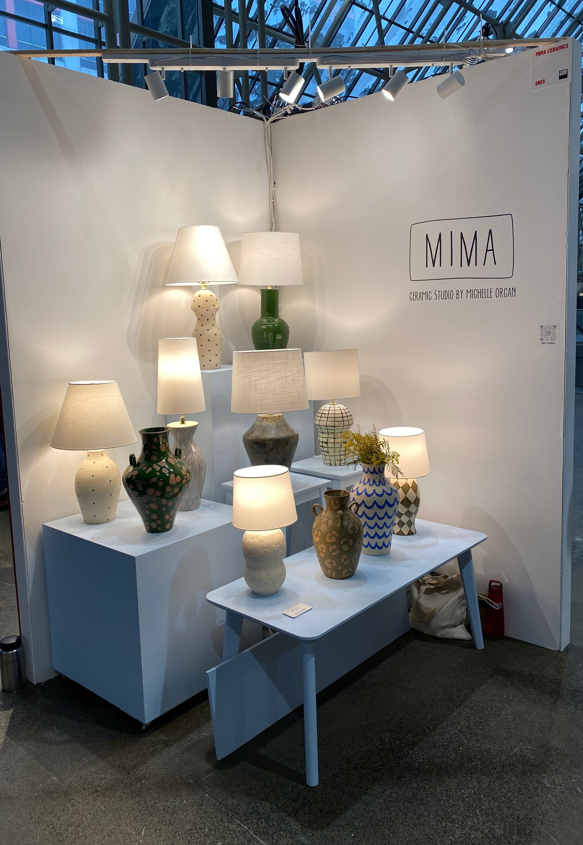 Wide shot of Mima ceramic lamps display.