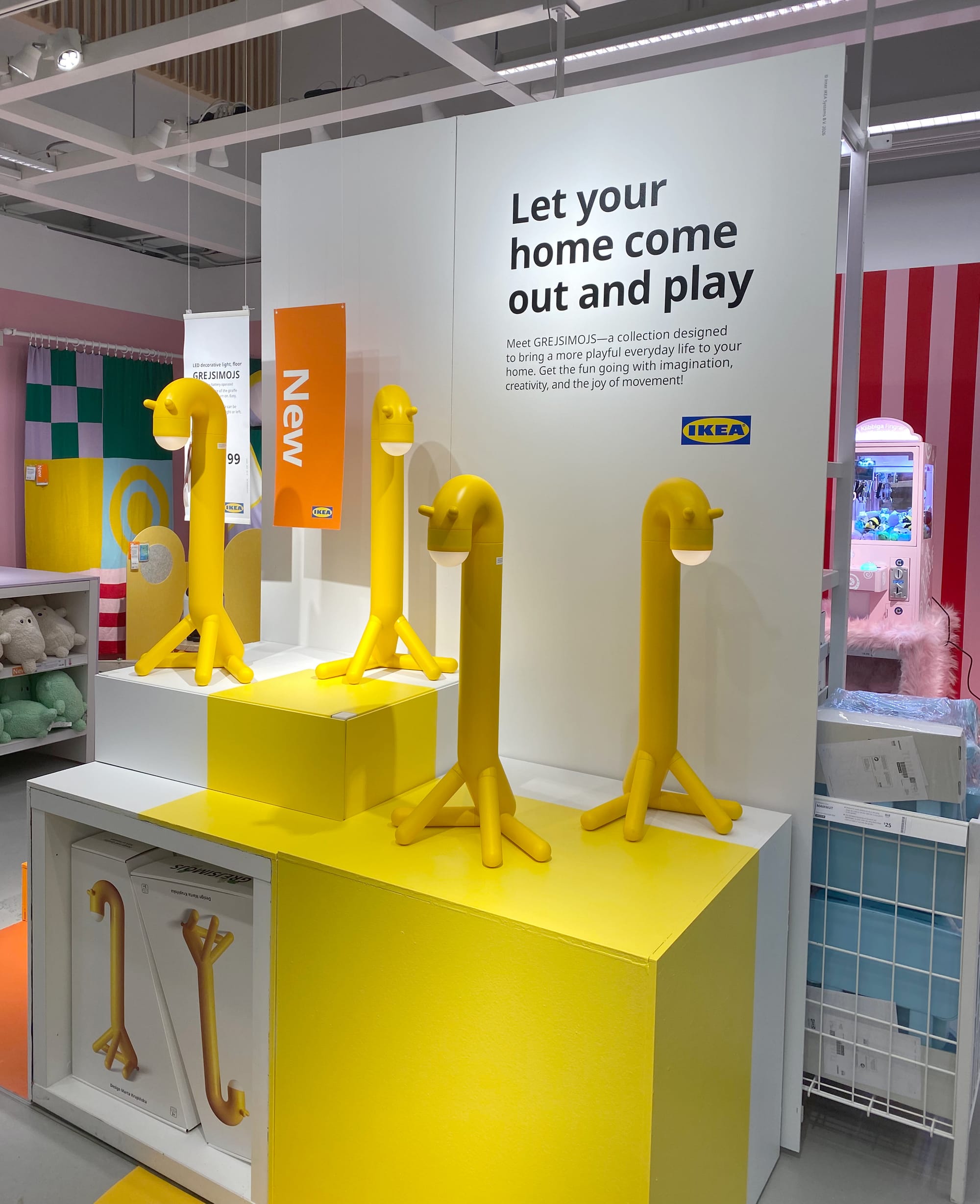 Wide shot of IKEA giraffe lamps.