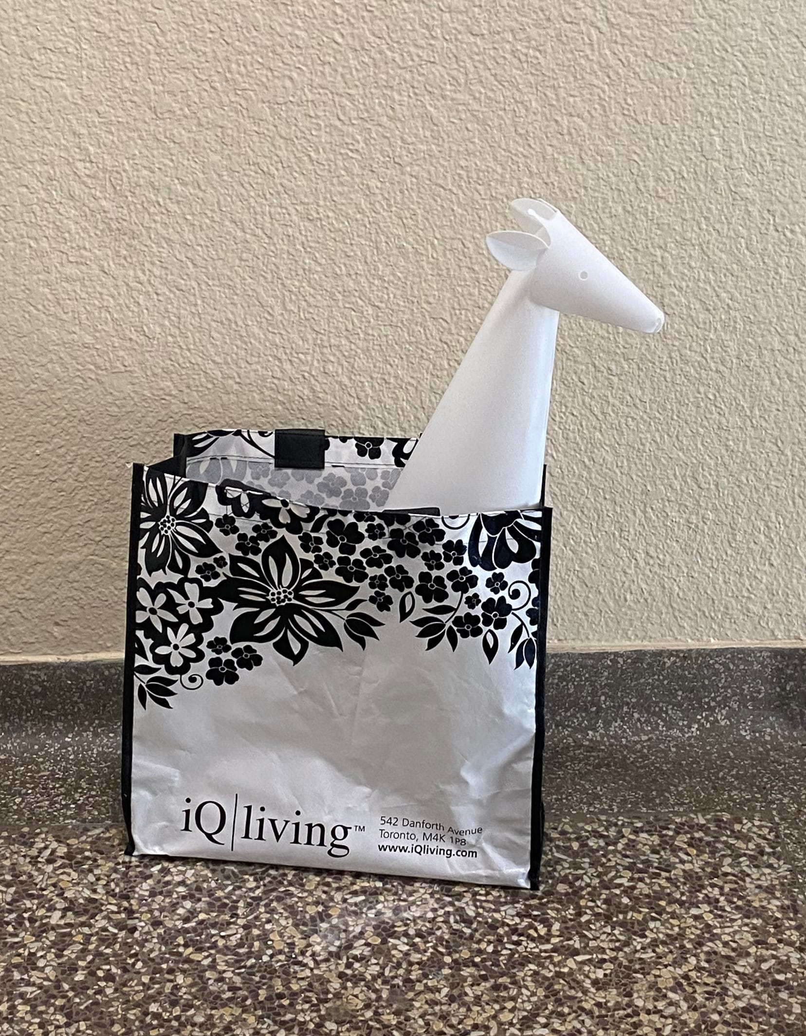 Giraffe night light in a shopping bag.