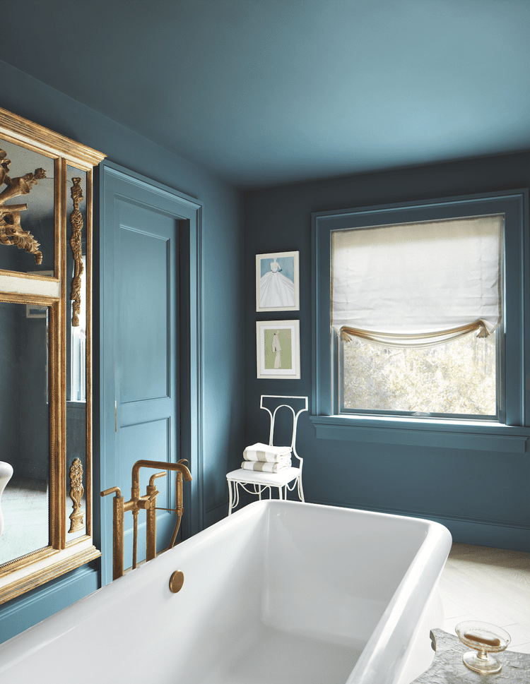 Bathroom with blue ceiling, walls and trim.