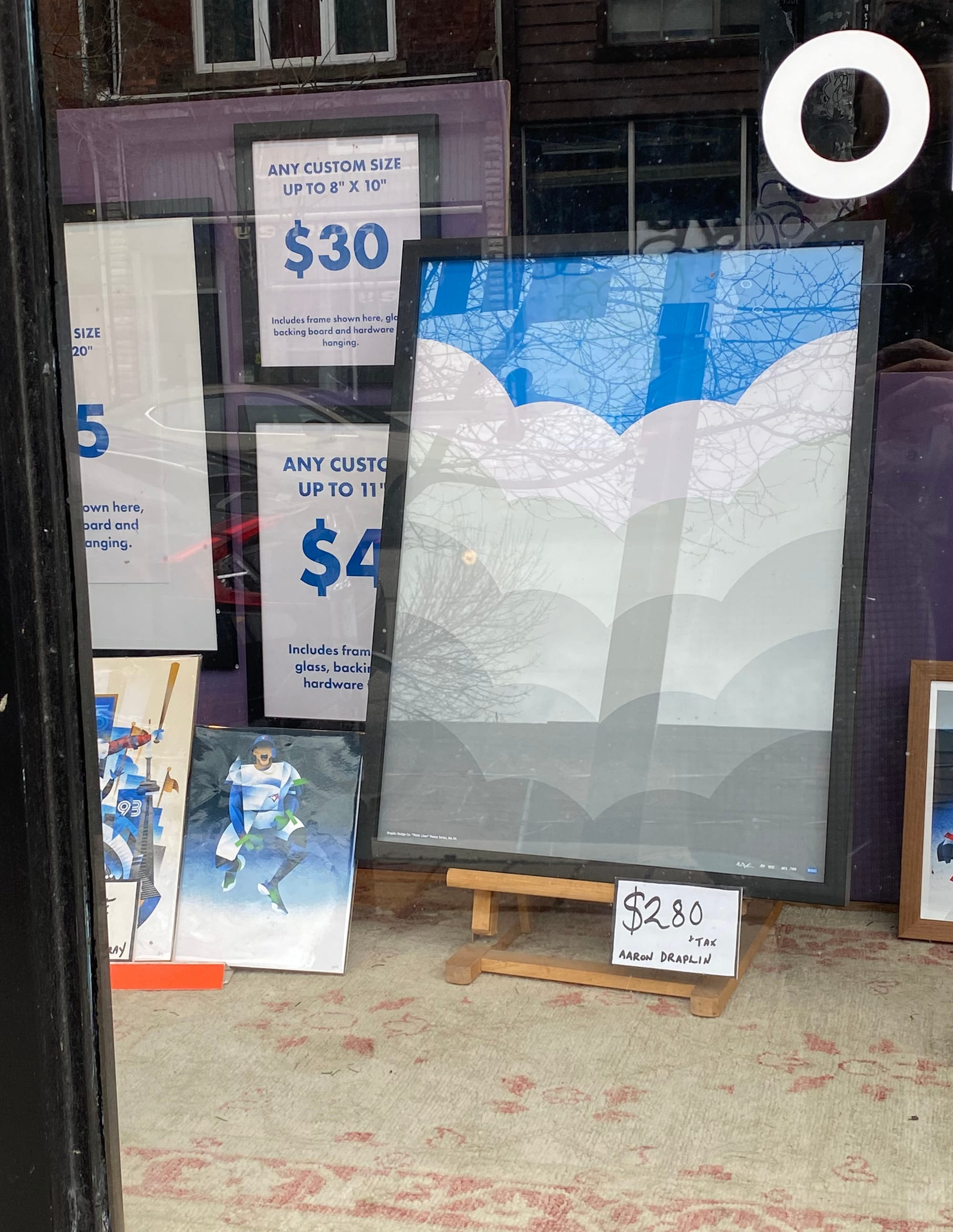 Framed cloud print in shop window.