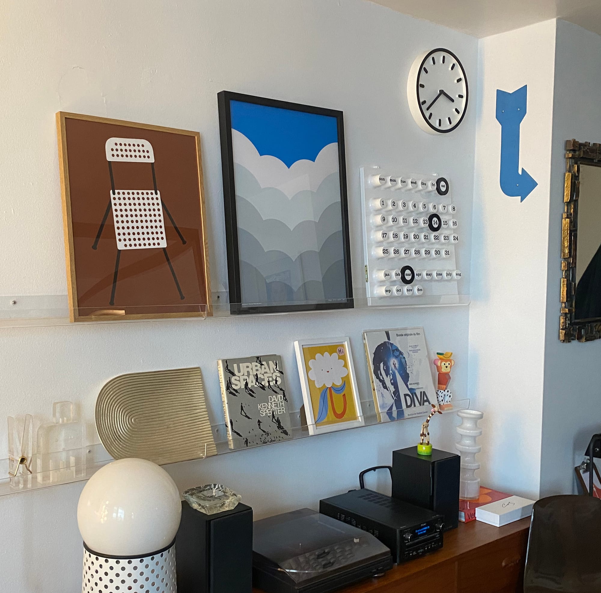 Gallery wall with a cloud print as the central feature.