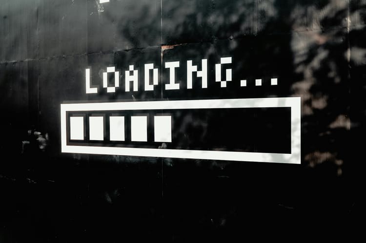 Street art featuring the word "LOADING..." and a progress bar underneath.
