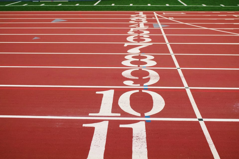 Running track with the numbers 1 through 11 for the various lanes.